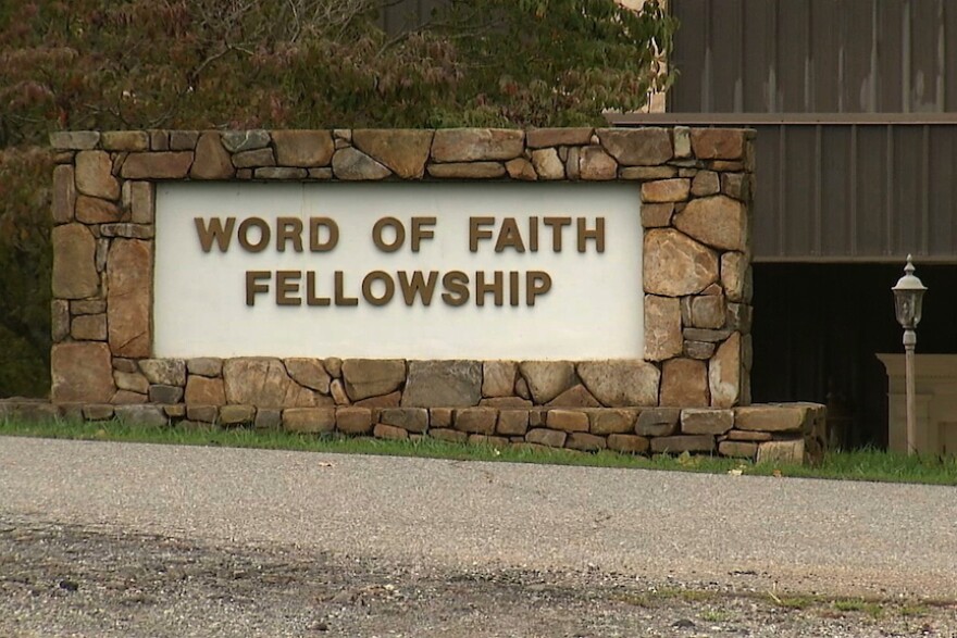 FILE - This 2016 image from video shows the entrance to the Word of Faith Fellowship church in Spindale, N.C. (AP Photo/Alex Sanz, File)
