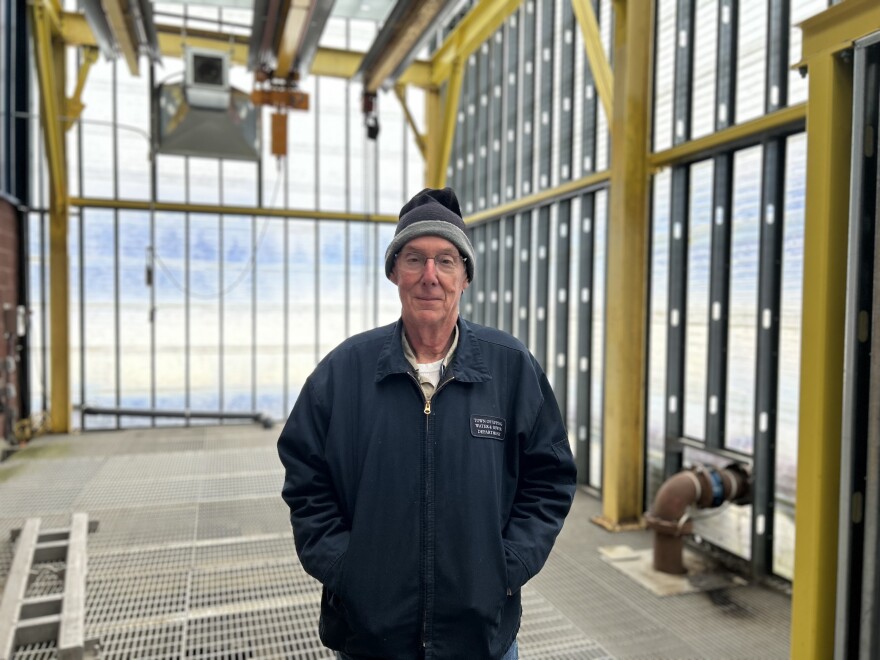 Bruce Bain, Epping's chief wastewater operator, stands on top of the tanks where bacteria digest human waste, cleaning the water so it can be discharged into the Lamprey River.