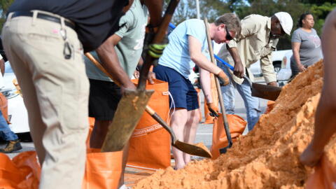 Residents pick up sandbags for storm preparation at the James Seals Jr. Parks & Recreation Center ahead of Hurricane Isaias' expected landfall along the Gulf Coast, Thursday, October 8, 2026, in Mobile, Alabama. (Octavio Jones/AP)