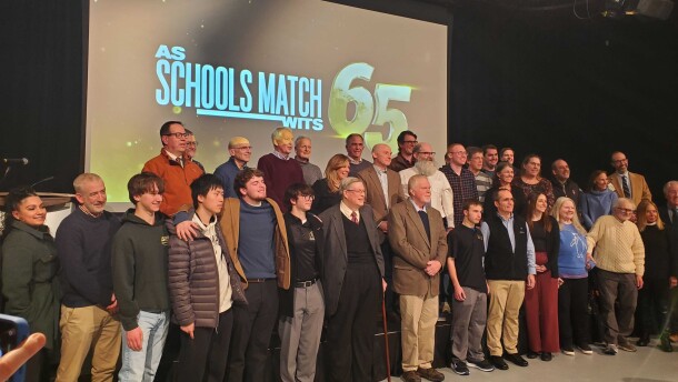 "As Schools Match Wits" is celebrating 65 years and a new documentary airing on NEPM TV on Jan. 31, 2026 at 7 p.m. details the show's history. Here past participants of the show as well as coaches and those who currently work on the show gather for a group photo after the screening of the documentary at NEPM. 