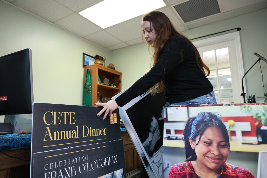 Lindsay McElroy, lead immigrant justice organizer at the Guatemalan Maya Center, which seeks to reunite families, in Lake Worth, shuffles through poster boards on display at the Center. Friday, February 13, 2026.