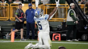 Detroit Lions running back David Montgomery (5) celebrates after a 2-yard touchdown run during the first half of an NFL football game against the Green Bay Packers, Thursday, Sept. 28, 2023, in Green Bay, Wis. (AP Photo/Morry Gash)