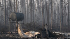 A charred oil tank left over from a house that burned in the Mukluk Fire.