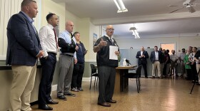 Standing in the newly-opened All Inclusive Support Service satellite office in Holyoke's War Memorial building, Hampden County Sheriff Nick Cocchi (center) says the space will address transportation hurdles some residents have faced in the past, with many needing to find rides to the AISS main office in Springfield.