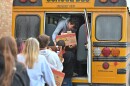 Forest City classmates hand Jacob Conlogue, a junior, boxes of food to be delivered.