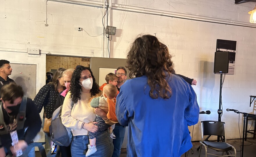 Parents wait for drag story time to start at Peabody Heights Brewery during the Waverly Book Festival on April 29. Photo by Scott Maucione/WYPR.