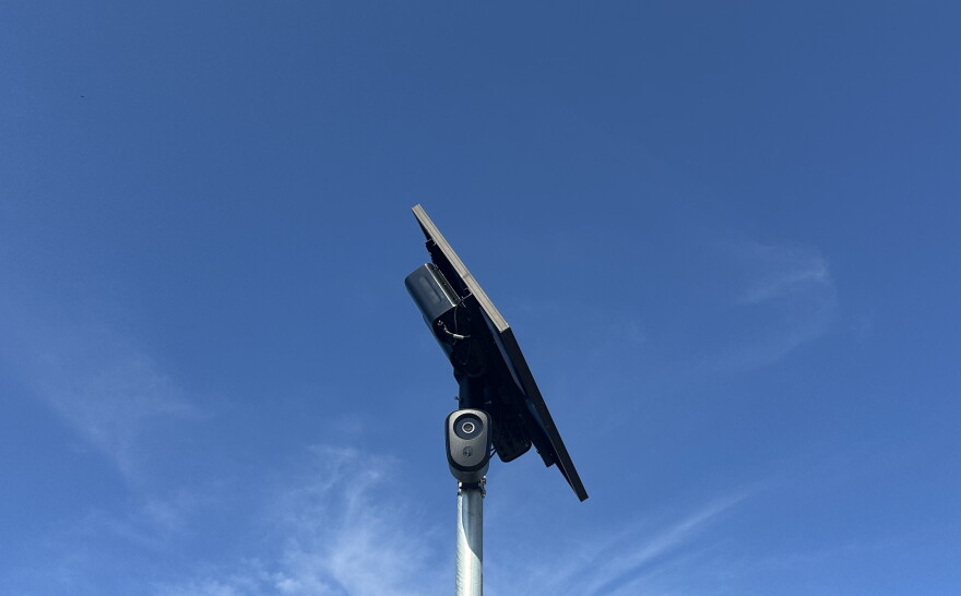 A Flock Safety camera on a pole.