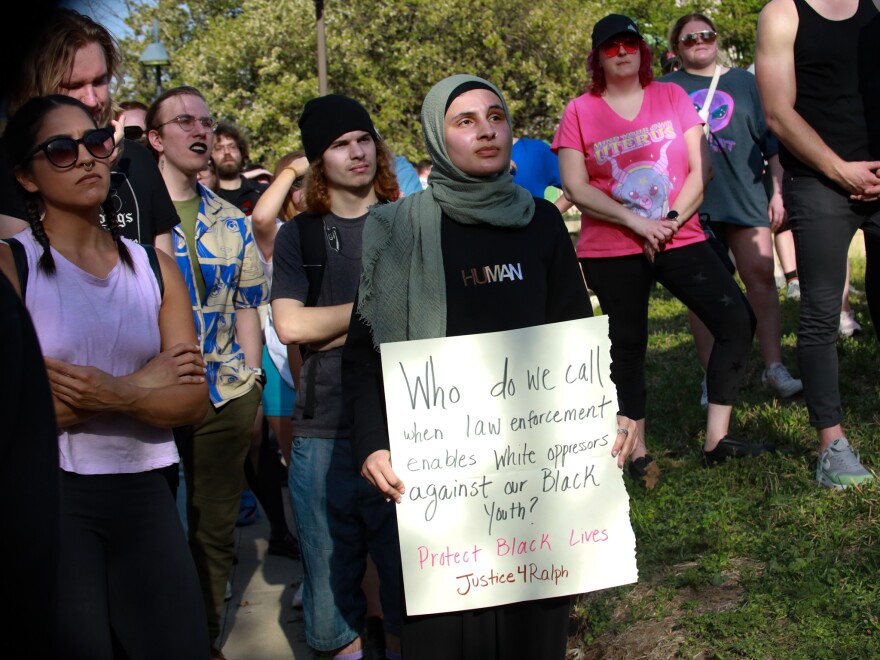 Yara Salamed holds a poster at a rally for Ralph Yarl.