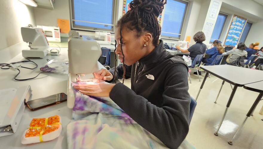 Pocono Mountain West freshman Lakia Joseph sews a dress that will be sent to Africa. Over the last 12 years, students from the school have sewn hundreds of dresses to send to Africa.