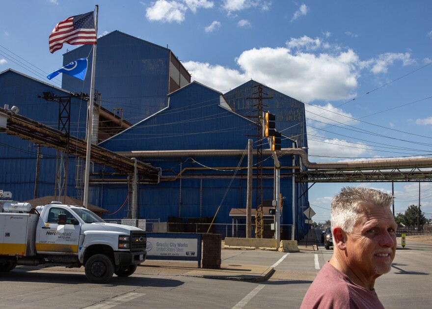A man looks for oncoming traffic as he leaves the U.S. Steel Granite City Works steel factory on Wednesday, Aug. 30, 2023, in Granite City, Ill. 