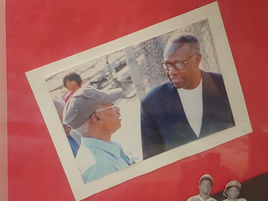 Hank Aaron visits with James Beckum, in this undated photo displayed in the Beckum-Stapleton Little League office.