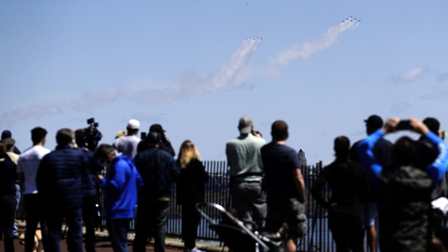 The Blue Angels and Thunderbirds military flight teams drew spectators in their pass over New York City on Tuesday to salute first responders.