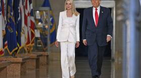 President Donald Trump arrives with Attorney General Pam Bondi to speak at the Justice Department in Washington, Friday, March 14, 2025.