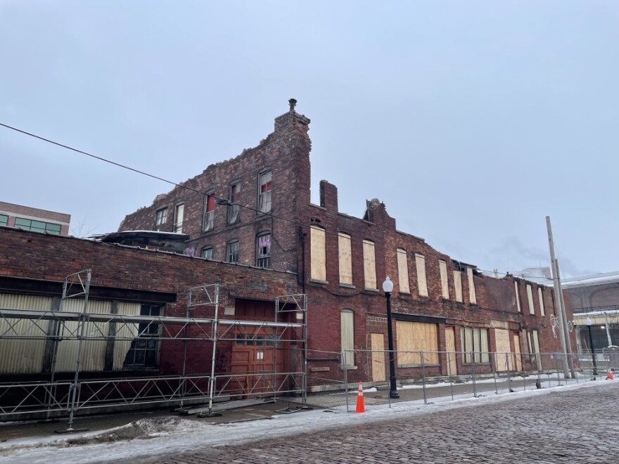 In June 2024, a fire gutted the properties, and the city subsequently stabilized the crumbling remains through a contractor.