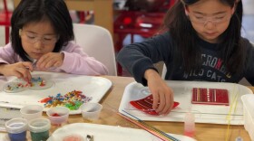 Students working in Brazee Street's glass studio.