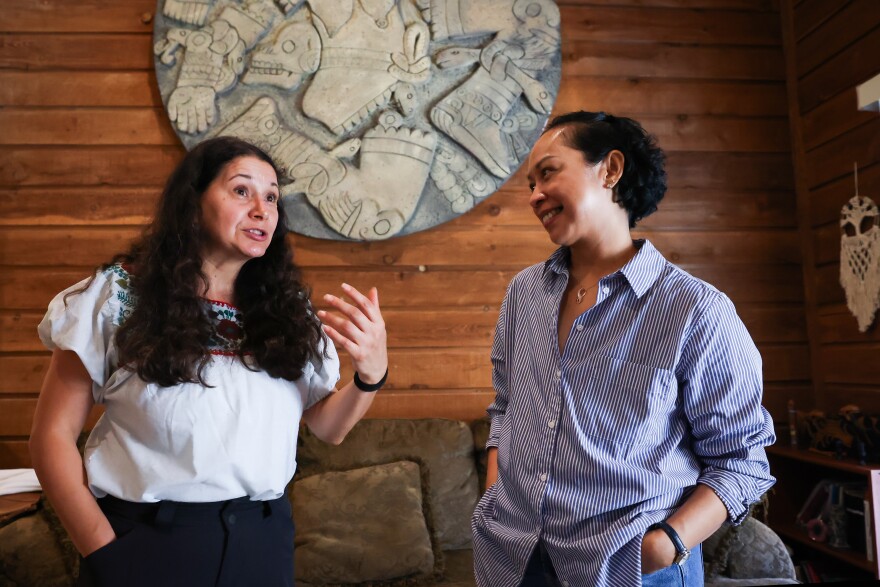 Artist Frida Espinosa Muller chats with Rosemarie Suegay who survived breast cancer ahead of the ‘Tell Her Story’ group exhibition on Tuesday, October. 7. 2025, in Dallas.