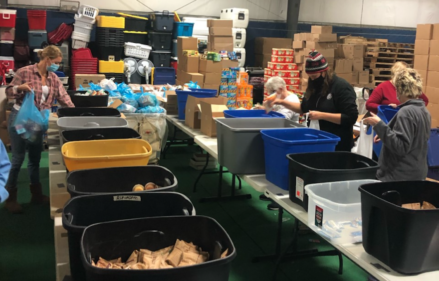 Volunteers pack food for the YMCA of Centre County's Anti-Hunger Program. 