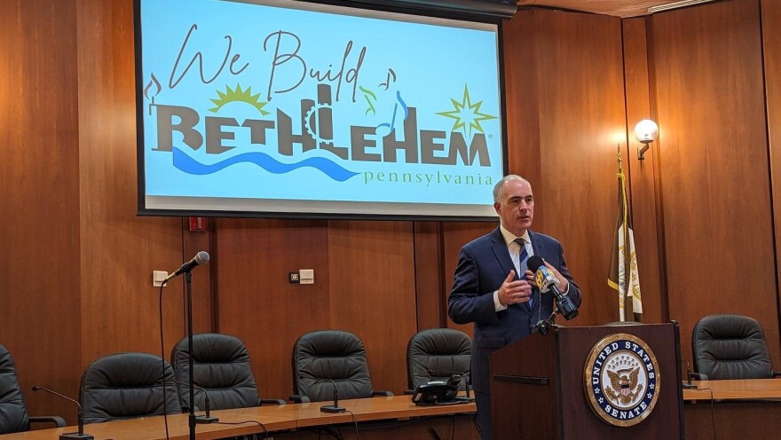 Senator Bob Casey speaks at a podium.