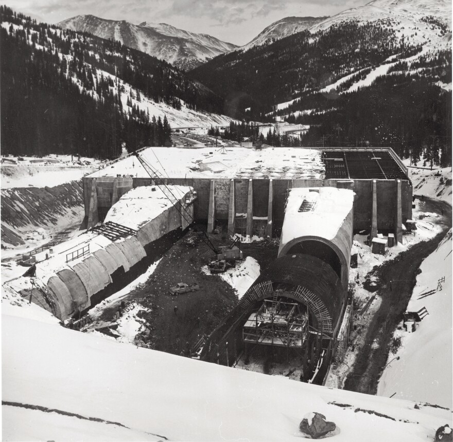 A black-and-white photo shows the Eisenhower Johnson Memorial Tunnels under construction.