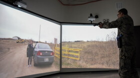 Airman 1st Class Daniel Pizano, 22nd Security Forces Squadron entry controller, practices the use of force during a multiple interactive learning objective training simulator scenario Feb. 6, 2020, at McConnell Air Force Base, Kansas. The MILO simulator provides more than 800 scenarios to security forces members.