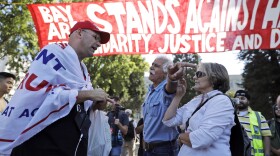 Donald Trump supporter Arthur Schaper, left, argues his position with Mustafa Payrvand, center, and Christina Tunnah during a free speech rally Sunday, Aug. 27, 2017, in Berkeley, Calif. Protesters gathered for a Rally Against Hate in response to a planned right-wing protest that raised concerns of clashes and prompted a large police presence. (AP Photo/Marcio Jose Sanchez)