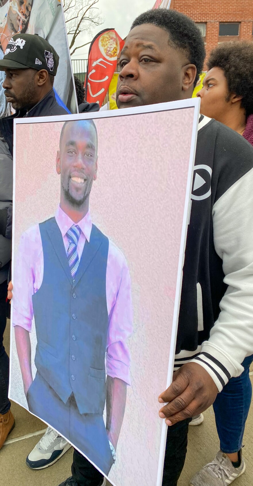Rico Howard, a co-worker of Tyre Nichols, holds a photo of him during a demonstration to demand answers for his death.
