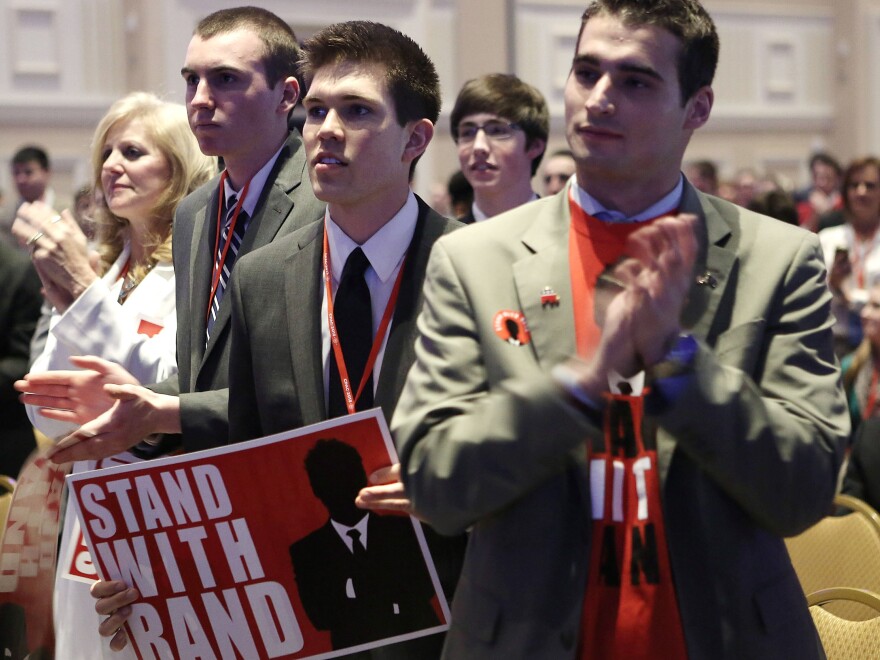 Supporters of Sen. Rand Paul, R-Ky., stand and applaud as Paul addresses the CPAC gathering.