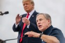 Texas Gov. Greg Abbott speaks alongside then-former President Donald Trump during a tour of an unfinished section of the border wall on June 30, 2021, in Pharr, Texas.