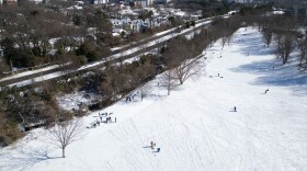 A snowfall that began late Saturday coated Raleigh, drawing eager sledders to Dix Park on Sunday to enjoy the winter weather.