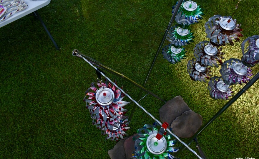 Whirligigs made from aluminun cans spins in the breeze at a yard sale participating in the US 12 Heritage Trail Garage Sale.