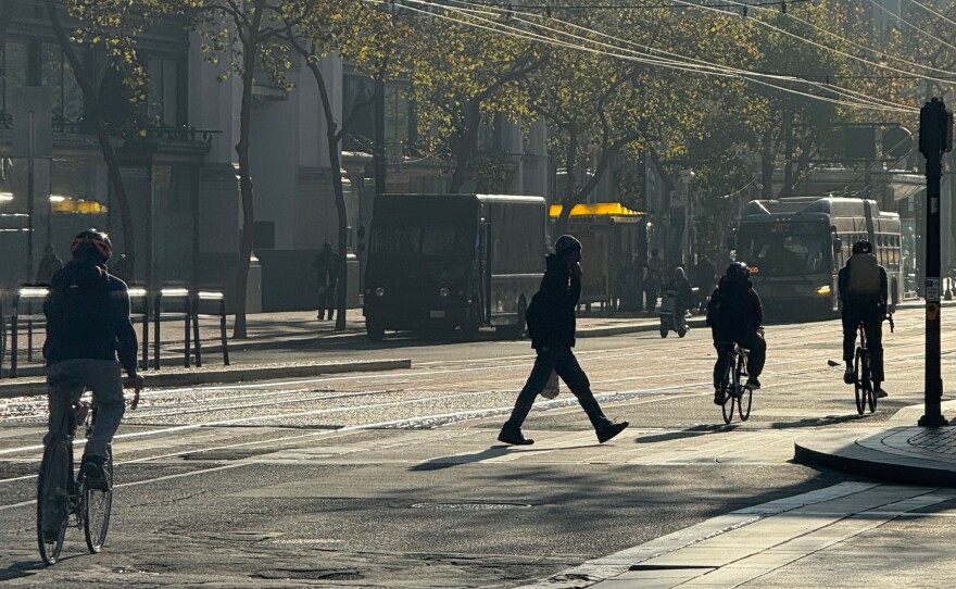 Cyclists and pedestrians on Market Street in December 2025. Over the summer, Mayor Lurie announced that some ride-hailing services could return to the corridor.