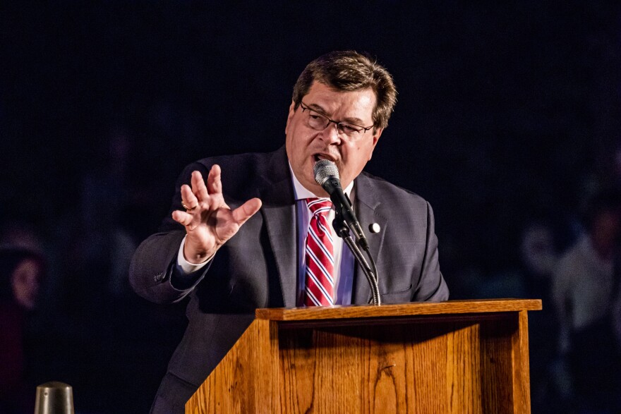 Larry Dietz speaking at a podium