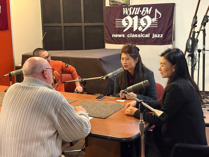 WSIU's Jeff Williams (back to camera) interviews (left to right) Bo Chen, program director with Guangdong Radio-TV in China, Yu Chen, a documentary director and Pan Chenhong, director of the Division of Chinese Media Convergence with Guangdong Radio-TV.