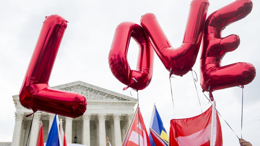 Same-sex marriage supporters from the Human Rights Campaign fly "LOVE" balloons Jun 26, 2015, in front of the U.S. Supreme Court as they await the court's decision in a same-sex marriage case. The justices' ruling legalized it nationwide.