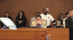 Erik Walsh, city manager, looks on as citizens relay their frustrations with police in a June 2020 council hearing