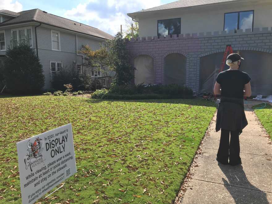 Rosemont Manor co-creator Kristen Johnson checks out the progress made on this year's design.