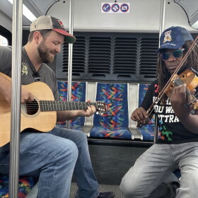 Musicians Nick Rose and Preston Charles the Third entertained commuters on TANK buses for a day.