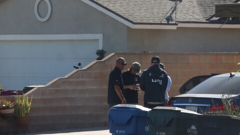 Agents with Homeland Security Investigations (HSI) conduct their investigation near the site where Carlos Jimenez was shot by federal immigration agents in Ontario on October 30, 2025.