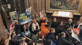 Protesters outside New York Gov. Kathy Hochul's office on March 25, 2026, in Albany urged her to back off her push to rollback regulations in the state's climate law.