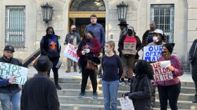 Residents of 800 North Spring Street and housing advocates gathered in front of Winston-Salem City Hall on Monday to protest the city's plan to sell the North Spring Street building to new owners. DJ SIMMONS/WFDD