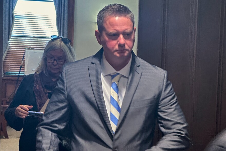 Former New York state trooper Christopher Baldner, who is charged in the death of an 11-year-old girl, leaves the court room during his trial Tuesday, Oct. 28, 2025 in Kingston, N.Y. (AP Photo/Michael Hill)