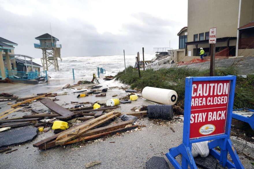 A public facility and life guard tower are seen partially collapsed near the Pirates Cove condominium due to a storm surge by Hurricane Nicole Thursday, Nov. 10, 2022, in Daytona Beach Shores, Fla. (AP Photo/John Raoux)