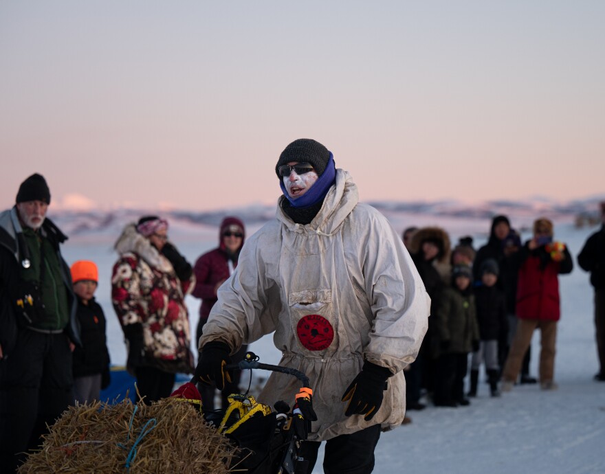 A musher leaves an Iditarod checkpoint.