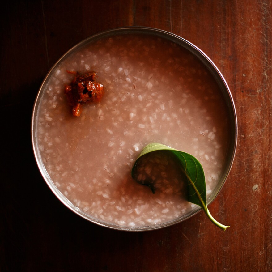 Kerala-style <em>kanji,</em> a South Indian rice porridge, served with a jackfruit leaf as a spoon.