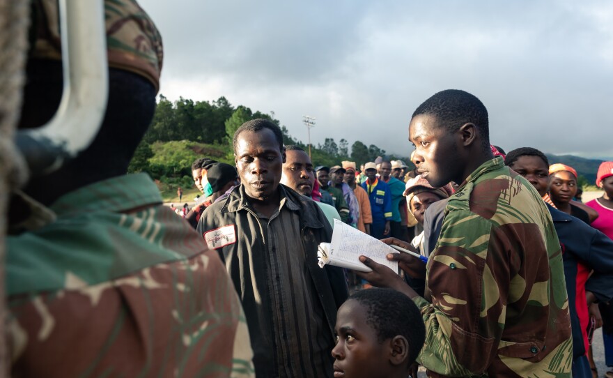 Food is handed out to villagers in Zimbabwe in the wake of Cyclone Idai, which triggered floods and mudslides.
