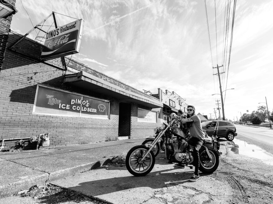 A member of the Blackbirds, one of Nashville's resurgent motorcycle clubs, stops outside Dino's, Nashville's oldest dive bar. The bar is family-friendly until 8 p.m.; it's just plain friendly after that.