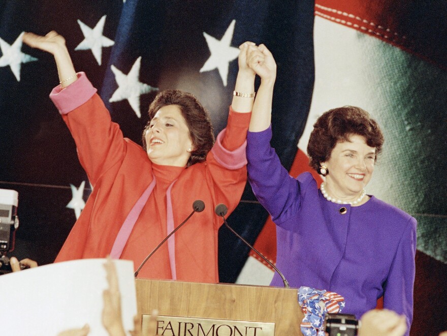Democratic Senate candidates Barbara Boxer (left) and Dianne Feinstein raise their arms in victory at an election rally in San Francisco on Nov. 4, 1992, the so-called "Year of the Woman" in politics.