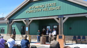 Several fire and government officials stand for a photo after a ribbon cutting at the Wyoming State Forestry Helibase in Casper on Thursday, Sept. 24, 2026.