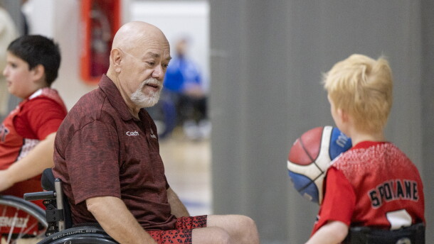 ParaSport Spokane assistant coach Z Zubrick and 11-year-old player Kaycen Dobbens.
