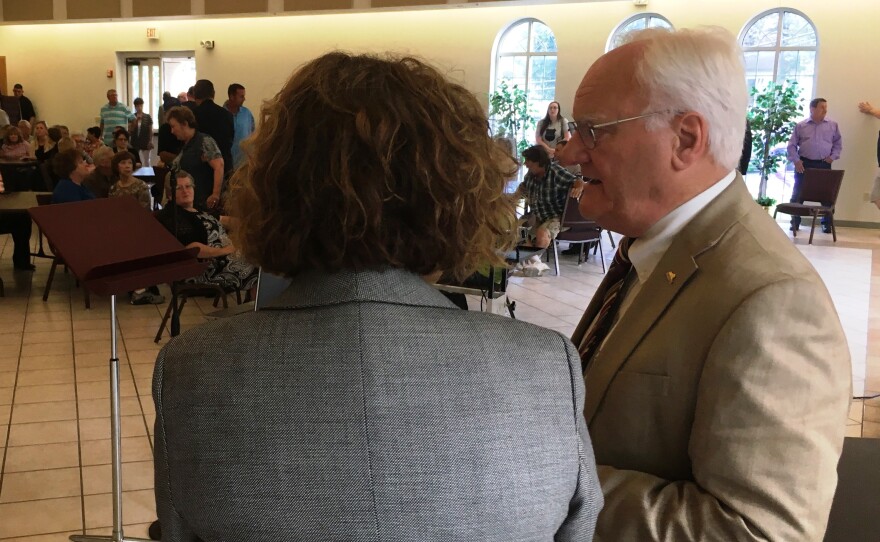 Gannaway and Williams confer before the meeting.